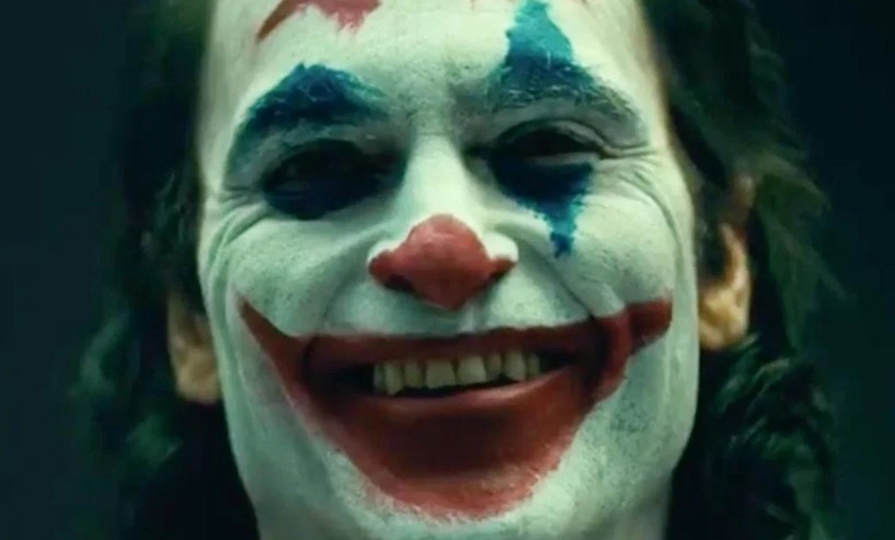 Christian Bale reacts to Joaquin Phoenix as Joker